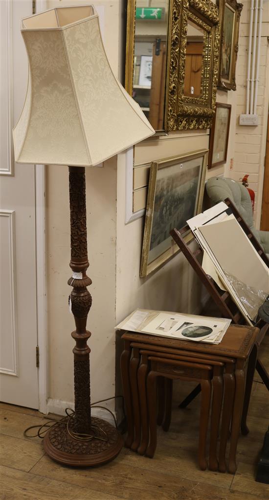 A carved standard lamp and carved set of four graduated side tables tables W.51cm, lamp W.35cm at base